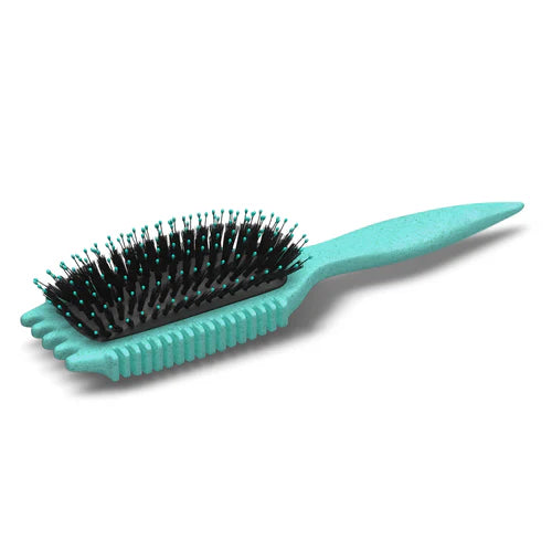 Bounce Curl Volume EdgeLift Brush in turquoise liggend, toont borstelstructuur en bio-based ontwerp voor natuurlijke haarverzorging.