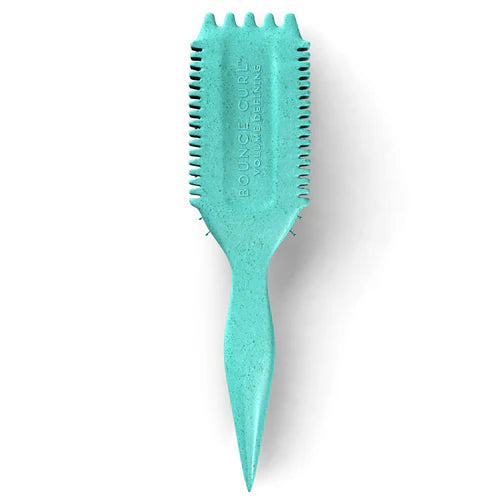 Achterkant van de turquoise Bounce Curl Volume EdgeLift Brush met gegraveerd logo en ergonomisch gevormd handvat.