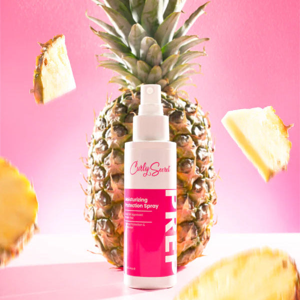 Curly Secret Moisturizing Protection Spray -UV Blocker 100ml haarspray met tropische ananasachtergrond, beschermt tegen UV, chloor en hitte.