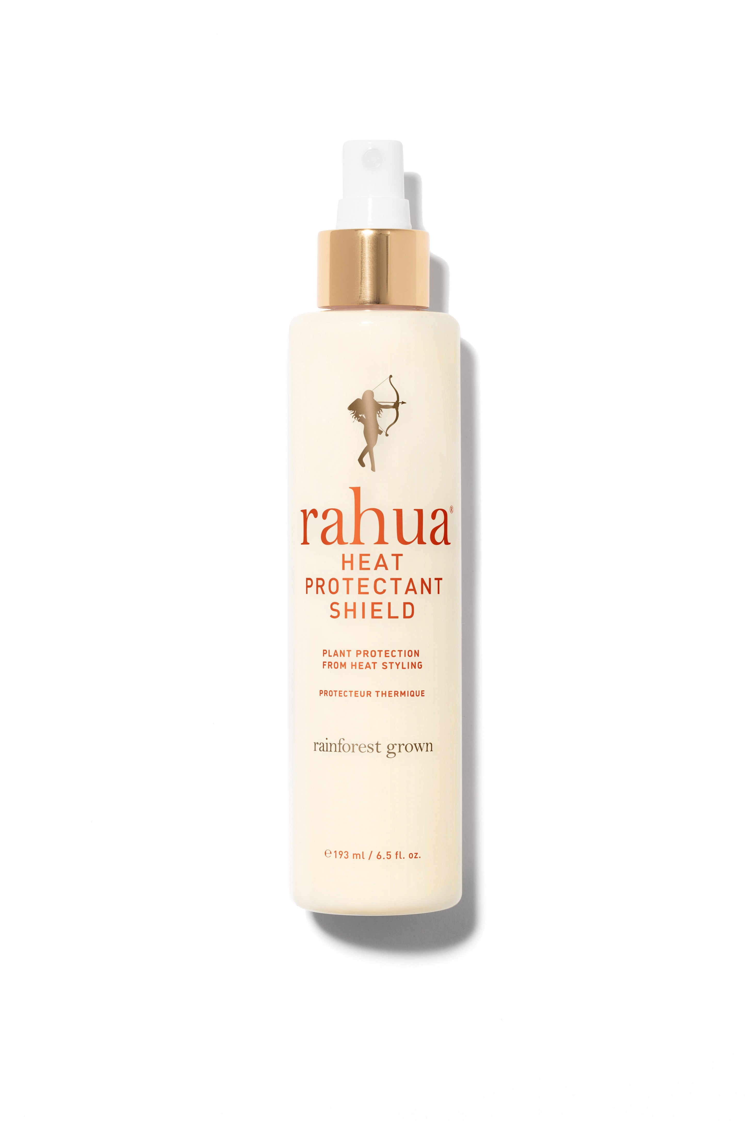 Heat Protectant Shield - Rahua - 193ml haarolie in een crèmekleurige sprayfles met gouden dop, ideaal voor hittebescherming bij haarverzorging.